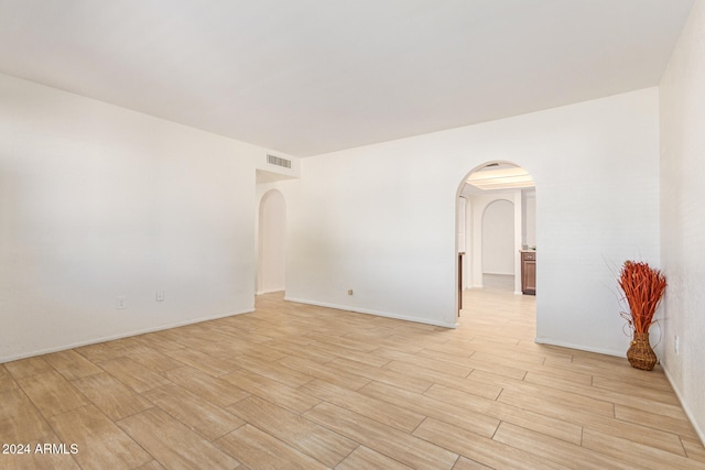 spare room featuring light hardwood / wood-style floors