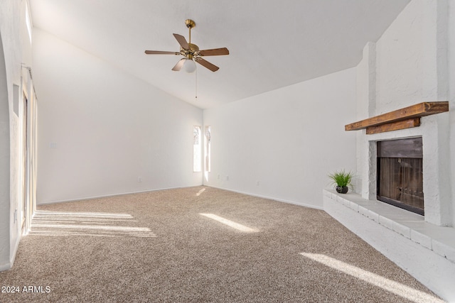 unfurnished living room with lofted ceiling, light colored carpet, a fireplace, and ceiling fan