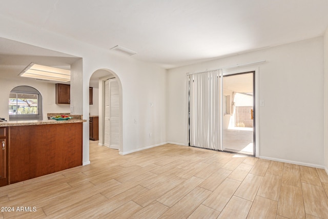 empty room with light hardwood / wood-style floors