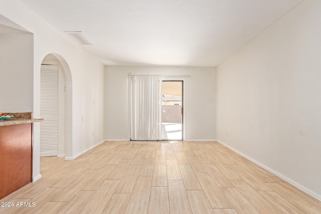 spare room featuring light wood-type flooring