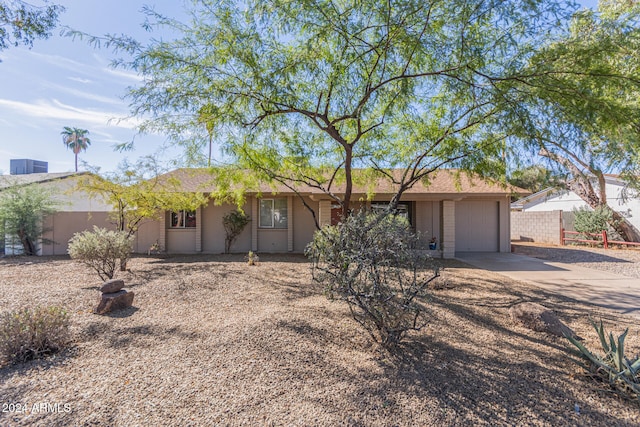 single story home with a garage