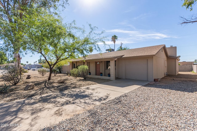 single story home with a garage