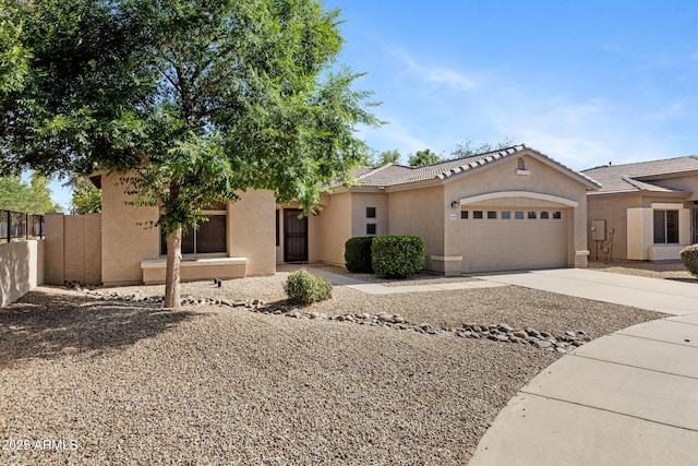 21299 E Roundup Way, Queen Creek, AZ 85142 - view of front of property featuring stucco siding, a garage, concrete driveway, fence, and a tiled roof