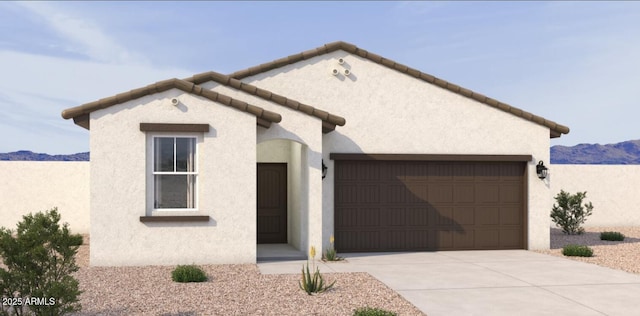 single story home featuring a mountain view, driveway, stucco siding, and a garage