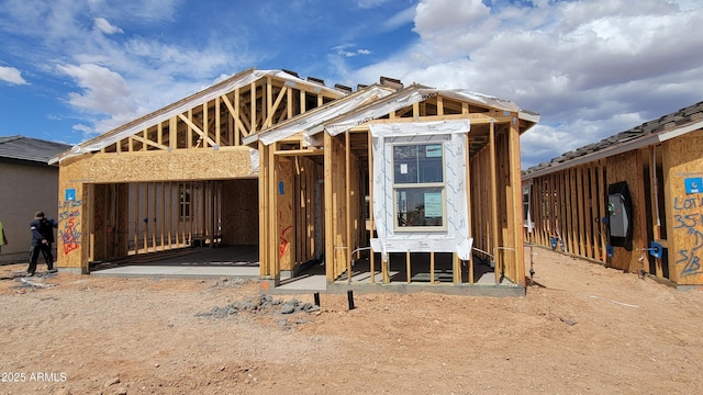 unfinished property featuring an outbuilding and exterior structure