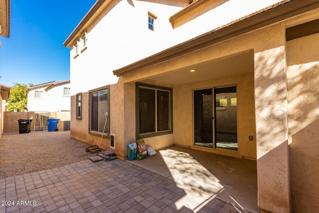 rear view of property featuring a patio area