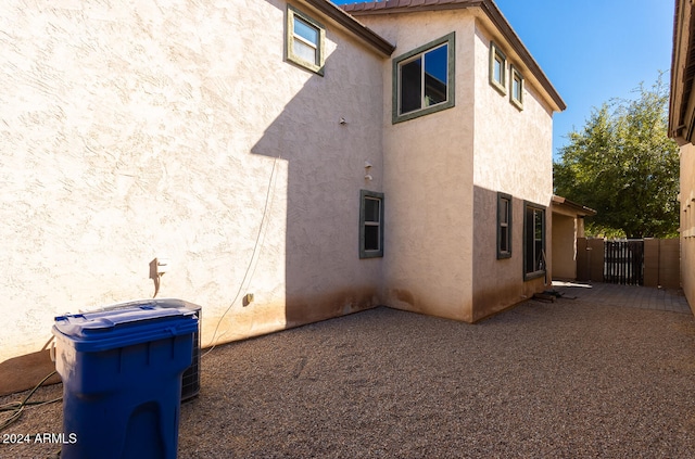 view of side of property with a patio