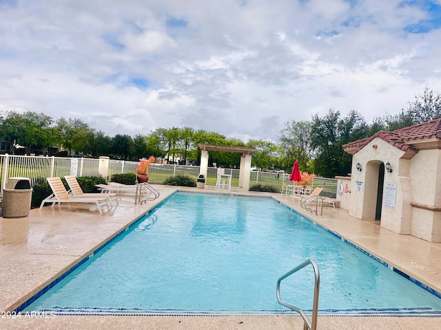 view of swimming pool with a patio