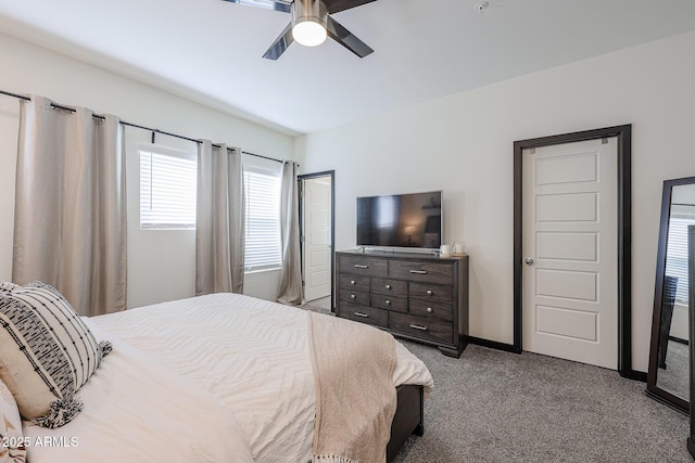 carpeted bedroom with baseboards and ceiling fan