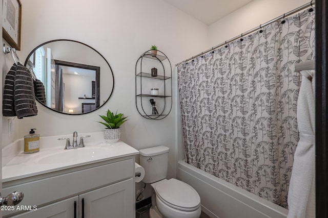 full bathroom featuring shower / tub combo, toilet, and vanity
