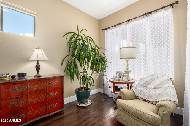 sitting room featuring baseboards and hardwood / wood-style flooring