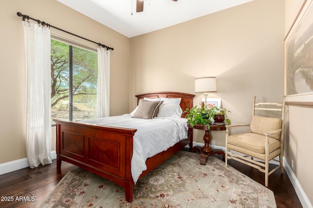 bedroom with a ceiling fan, baseboards, and hardwood / wood-style floors