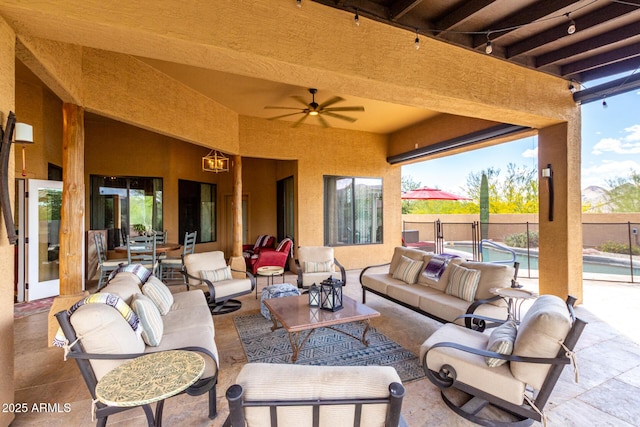 view of patio / terrace featuring an outdoor hangout area, fence, a fenced in pool, and ceiling fan