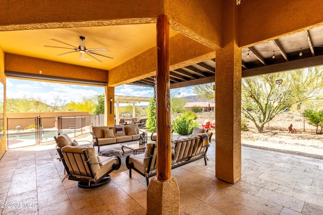 view of patio / terrace featuring an outdoor living space, a fenced backyard, a ceiling fan, and a fenced in pool