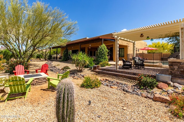 view of yard with a fire pit and a patio area