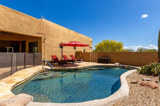 view of swimming pool with fence, a fenced in pool, and a patio area