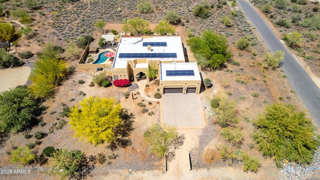drone / aerial view featuring a desert view