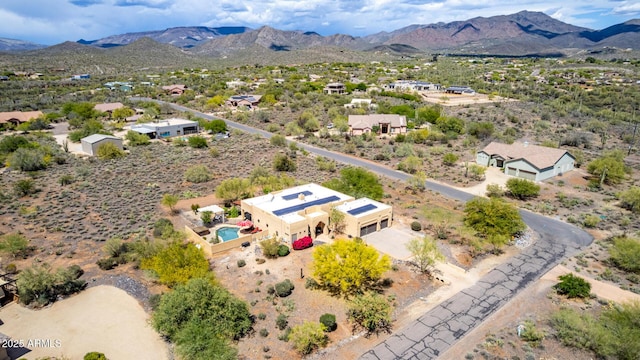 birds eye view of property with a mountain view