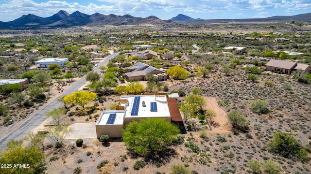 aerial view featuring a mountain view and a desert view