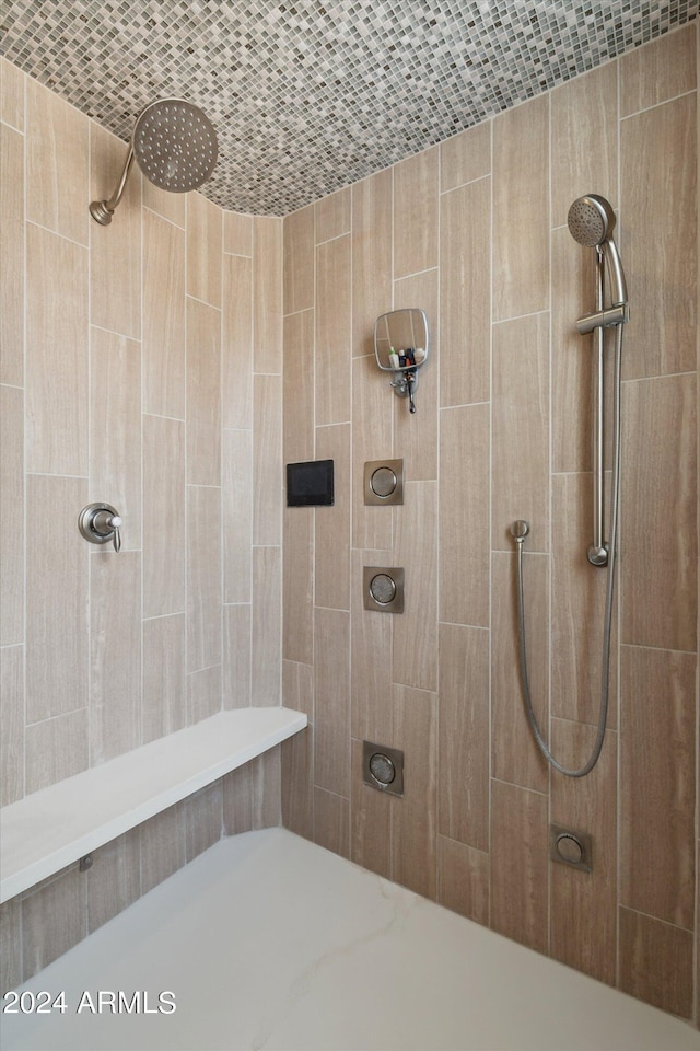 bathroom with a tile shower