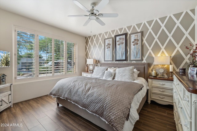 bedroom featuring dark hardwood / wood-style flooring and ceiling fan