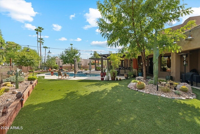 view of yard with a fenced in pool