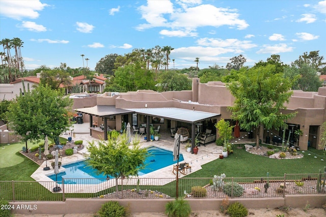 view of pool featuring a yard and a patio