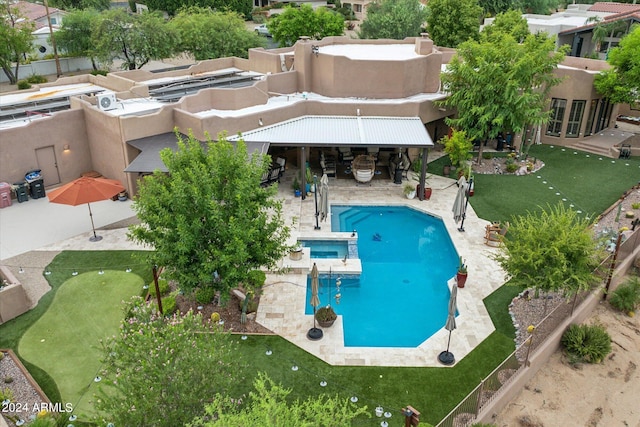 view of swimming pool featuring an outdoor bar and a patio