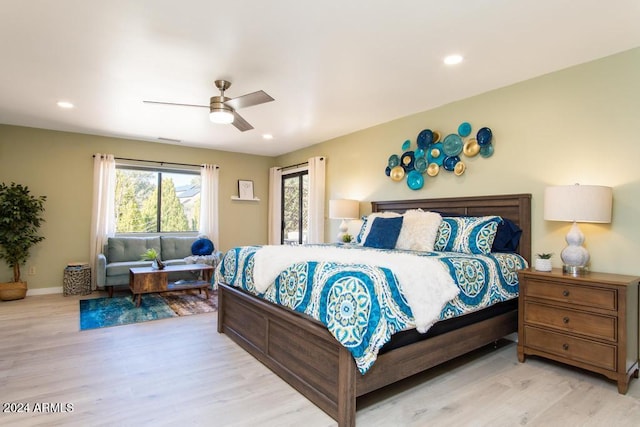 bedroom featuring ceiling fan and light hardwood / wood-style floors