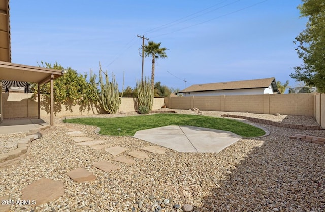 view of yard featuring a patio area and a fenced backyard