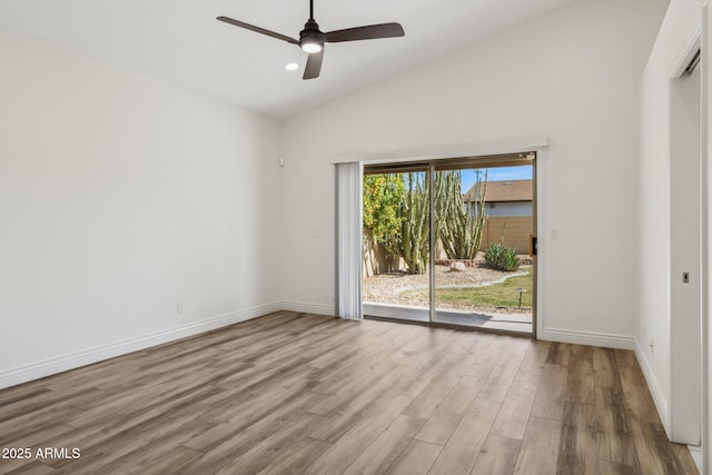 empty room featuring light wood finished floors, baseboards, lofted ceiling, ceiling fan, and recessed lighting