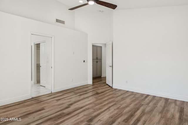 unfurnished bedroom featuring baseboards, visible vents, and light wood finished floors