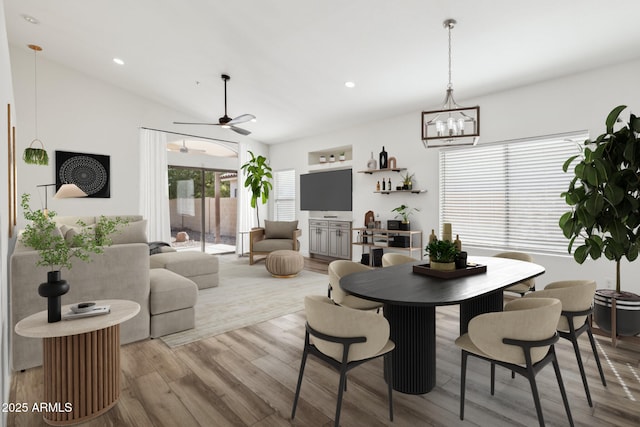 dining area featuring ceiling fan, light wood-type flooring, lofted ceiling, and recessed lighting