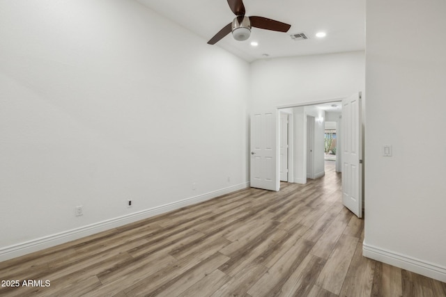 unfurnished bedroom featuring baseboards, recessed lighting, visible vents, and light wood-style floors