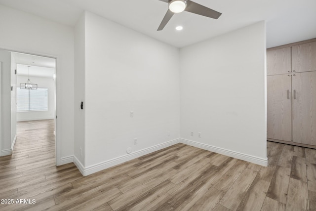 unfurnished bedroom featuring recessed lighting, light wood-type flooring, and baseboards