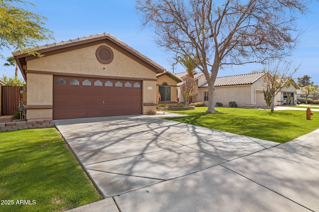 ranch-style home with a garage, driveway, a front lawn, and stucco siding