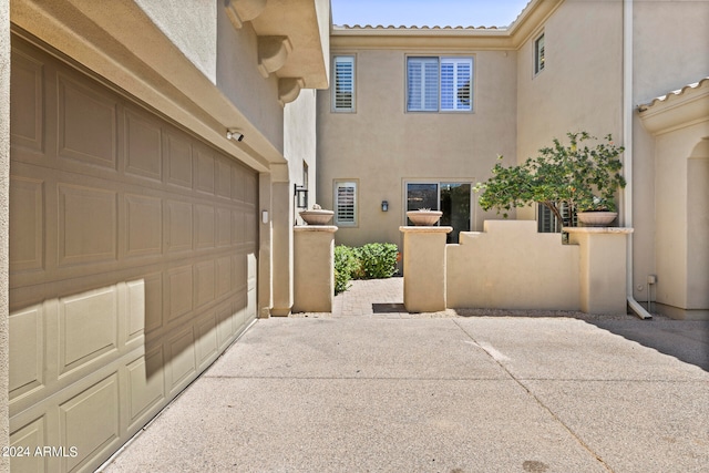 view of property exterior with a garage