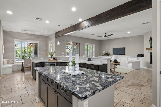 kitchen with pendant lighting, plenty of natural light, and a spacious island