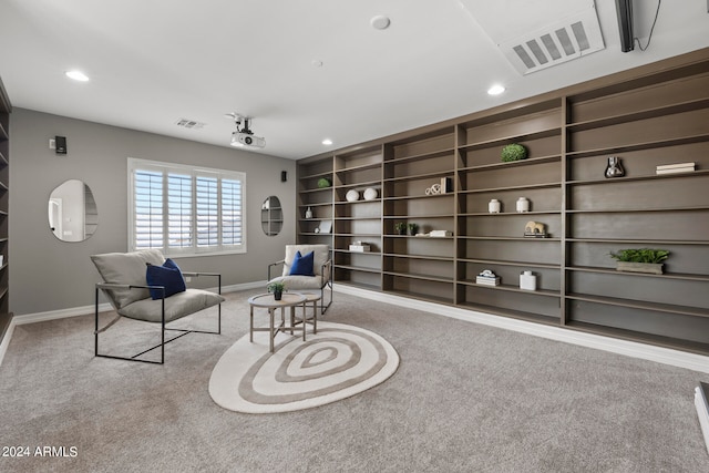 living area with light colored carpet