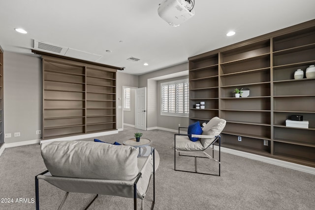 living room featuring light carpet