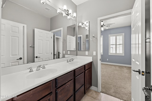 bathroom featuring tile patterned flooring, vanity, and ceiling fan