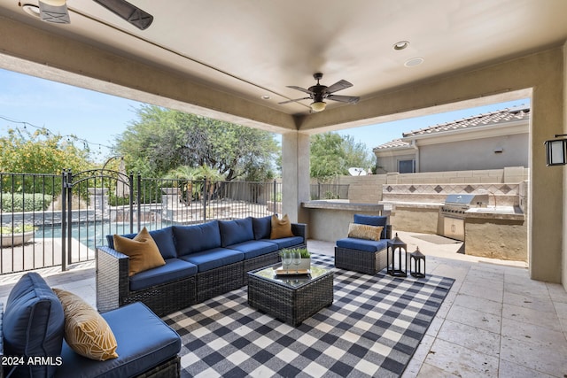 view of patio / terrace featuring an outdoor hangout area, ceiling fan, exterior kitchen, grilling area, and a fenced in pool