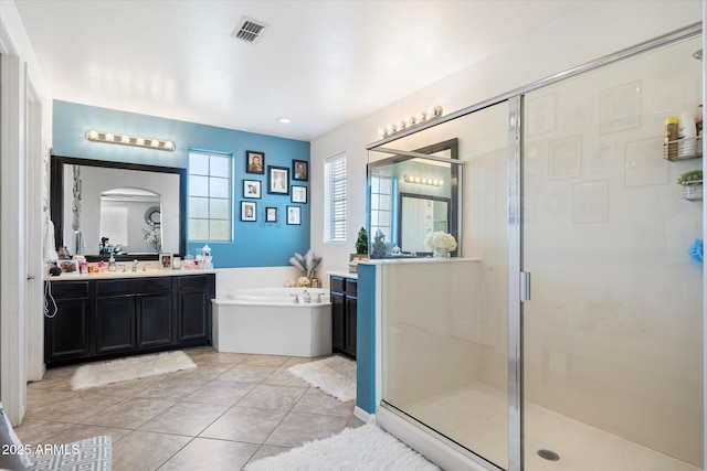 bathroom with vanity, plus walk in shower, and tile patterned flooring