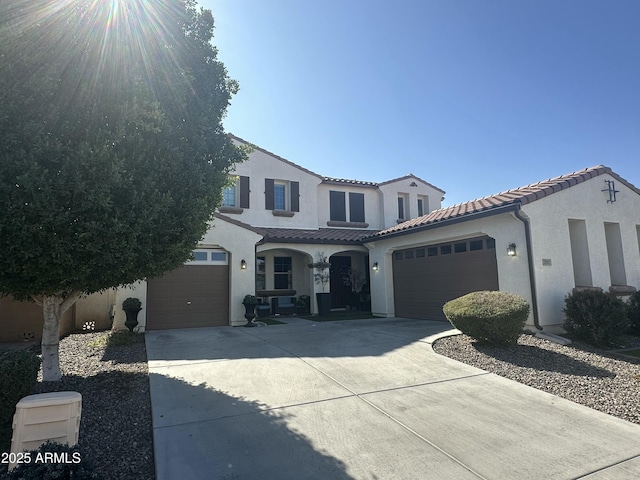 mediterranean / spanish home featuring a garage