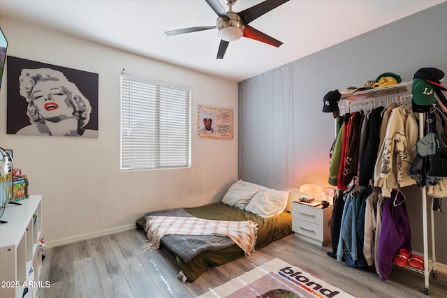 bedroom featuring ceiling fan and light hardwood / wood-style flooring