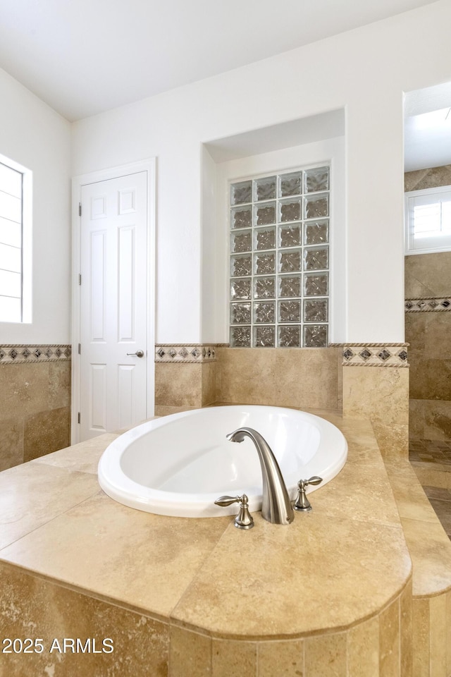 bathroom featuring a bath