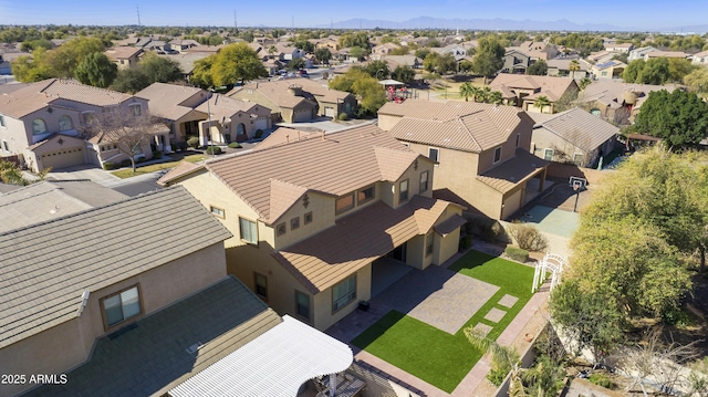 birds eye view of property with a residential view and a mountain view