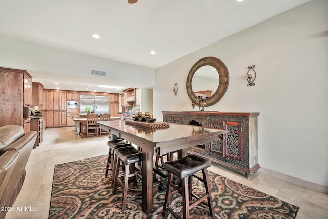 dining space with light tile patterned floors, visible vents, baseboards, and recessed lighting