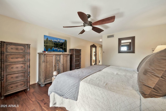 bedroom with ceiling fan, visible vents, and dark wood-style floors