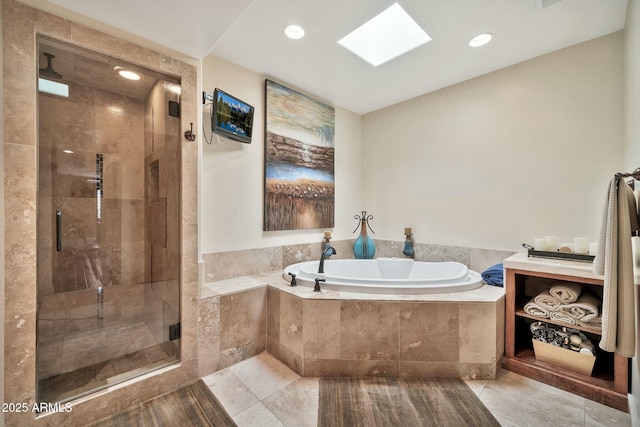 bathroom with tile patterned floors, recessed lighting, a stall shower, a skylight, and a bath